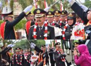 Tradisi Pedang Pora Warnai Wisuda Purna Bhakti 19 Personel Polri dan ASN Polda Sulteng